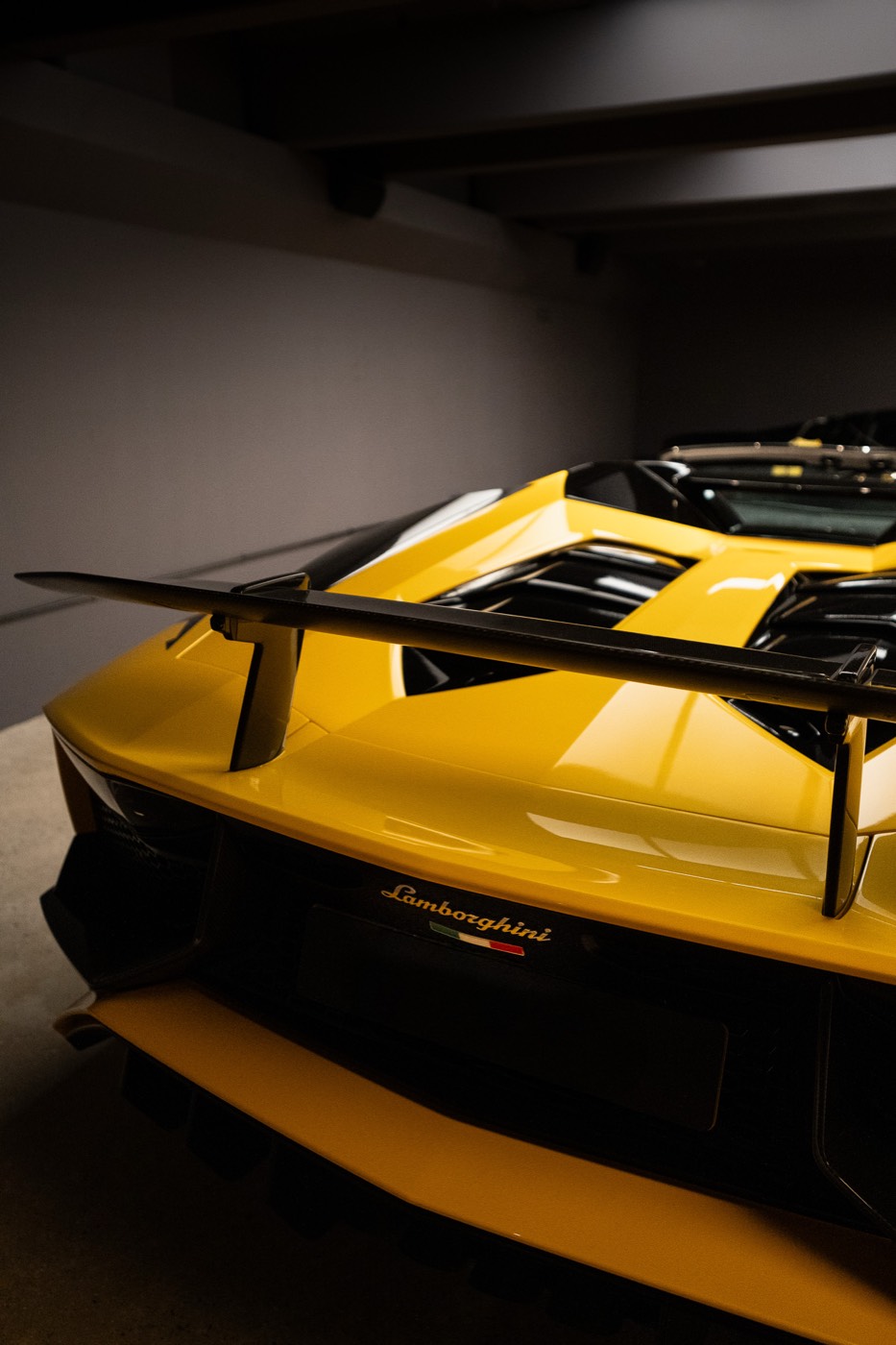 Lamborghini Aventador SVJ rear wing and Lamborghini badge close up
