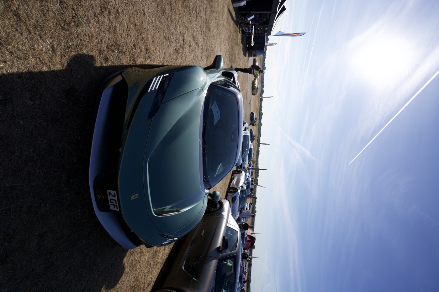 Green Ferrari SF90 Stradale front end in the sun at a PistonHeads meet