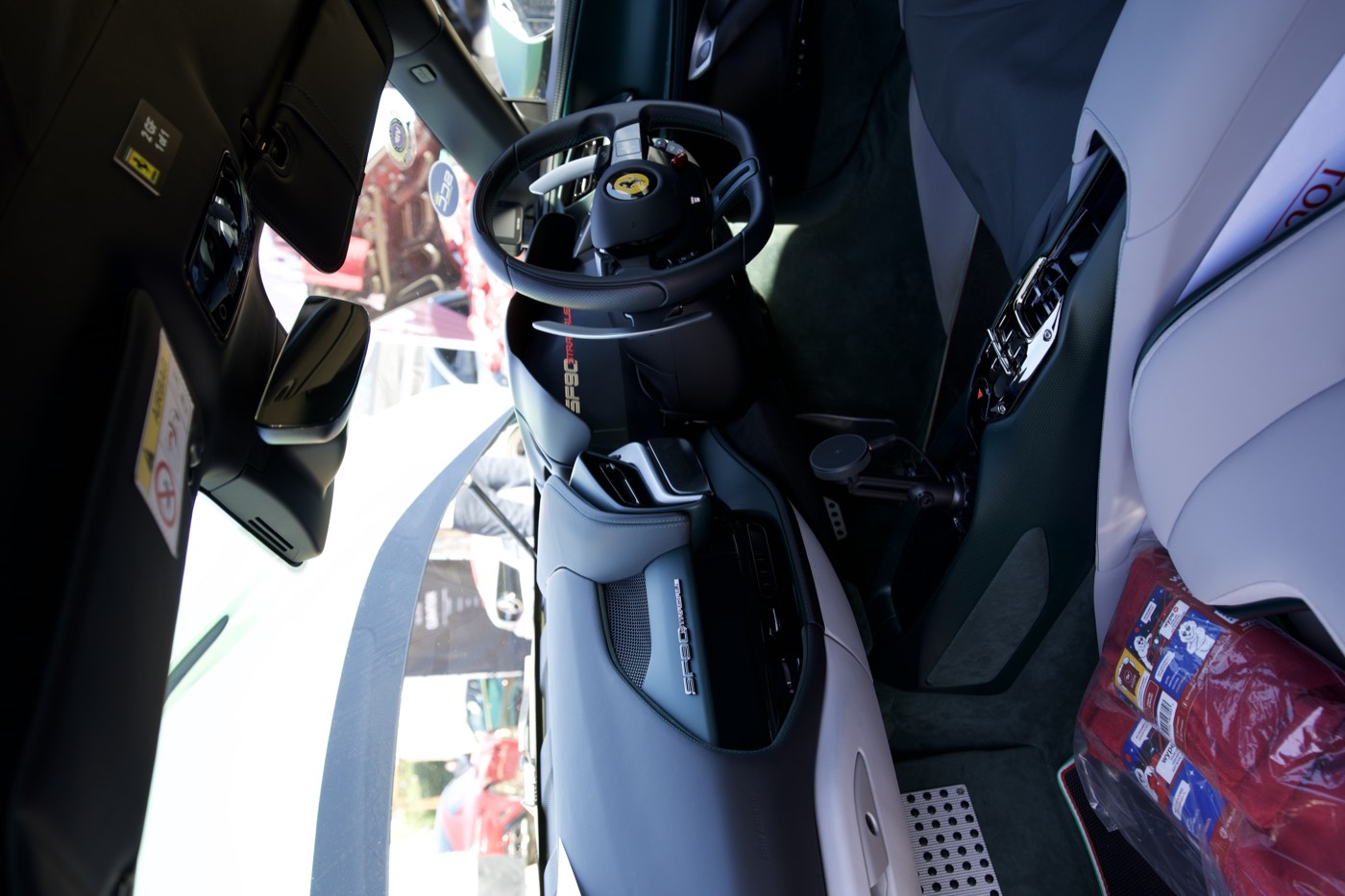 wype towel on the seat of a Ferrari SF90 Stradale interior